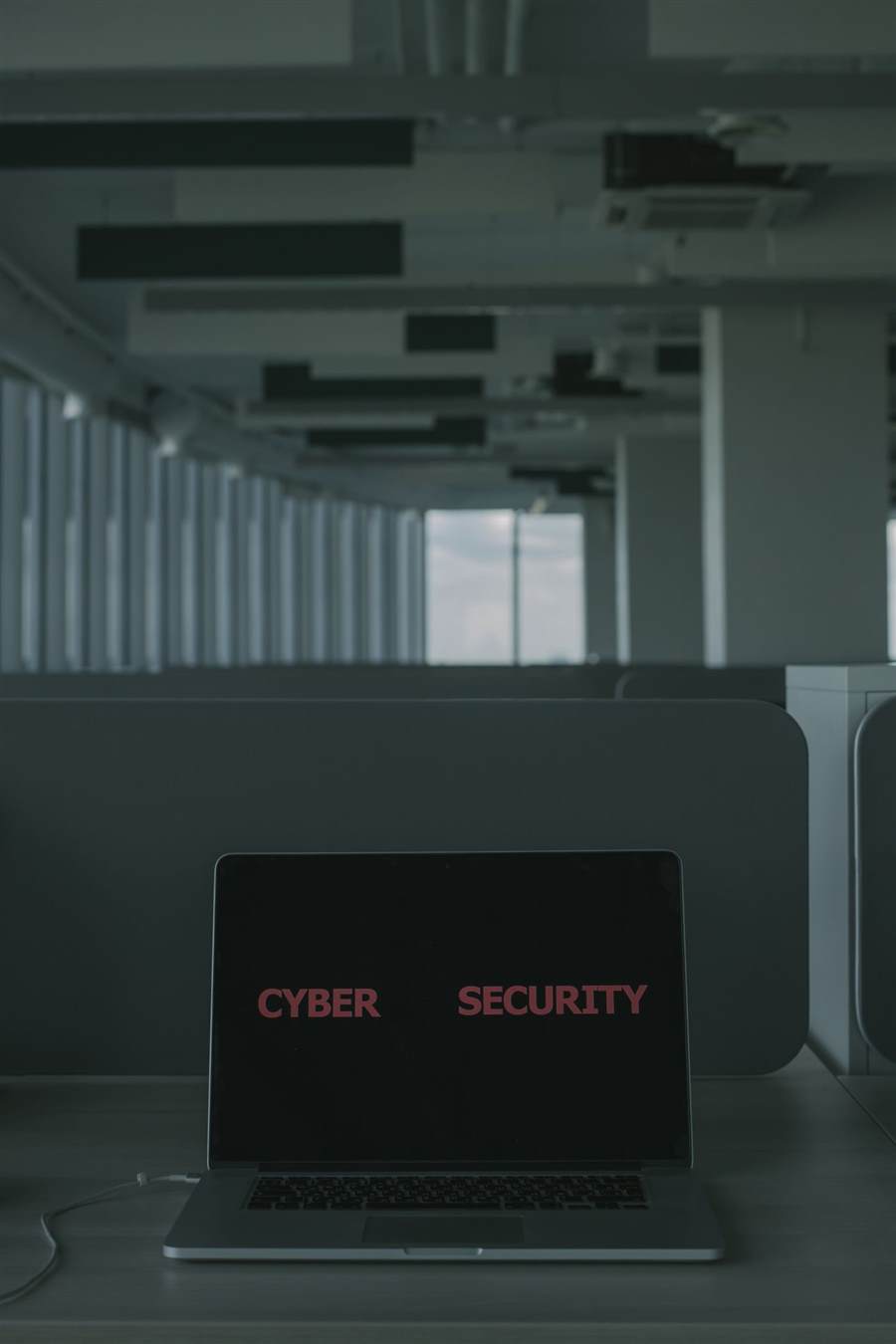 Laptop displaying a cybersecurity screen in an office